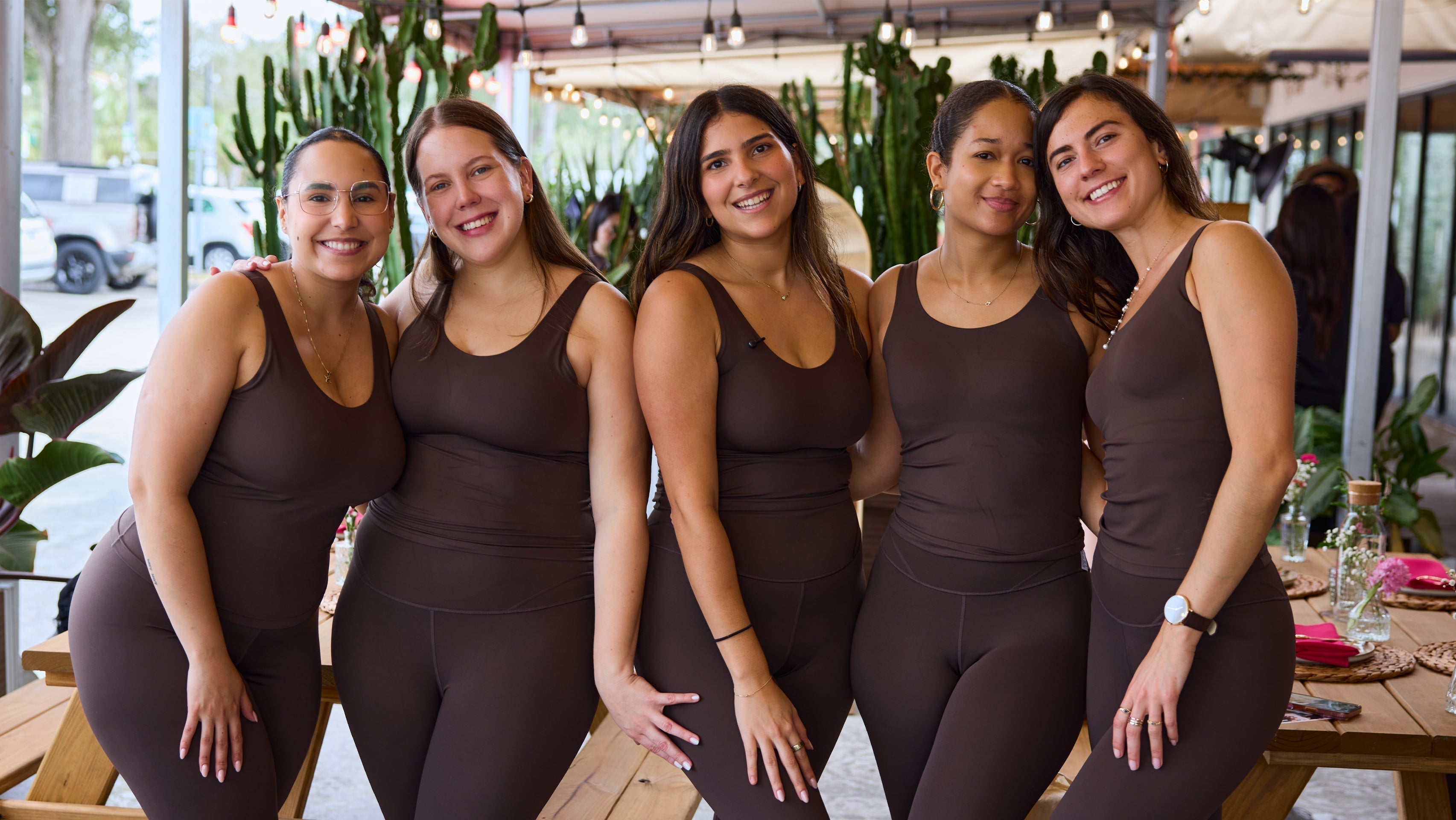 Image of Five women wearing Everleaf yoga sets in a group photo.